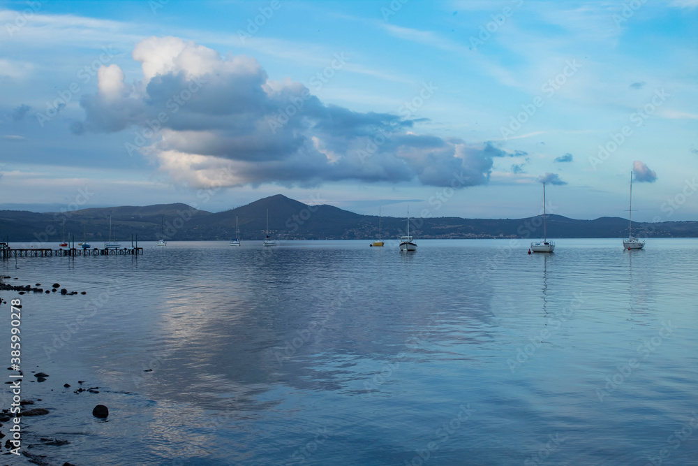 panorama of the lake of Bracciano 
blue sky with clouds reflected in the water