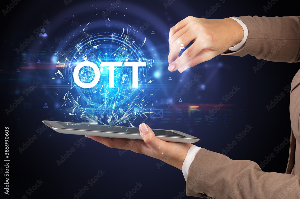 Close-up of a touchscreen with OTT abbreviation, modern technology concept Close-up of a touchscreen with OTT abbreviation, modern technology concept