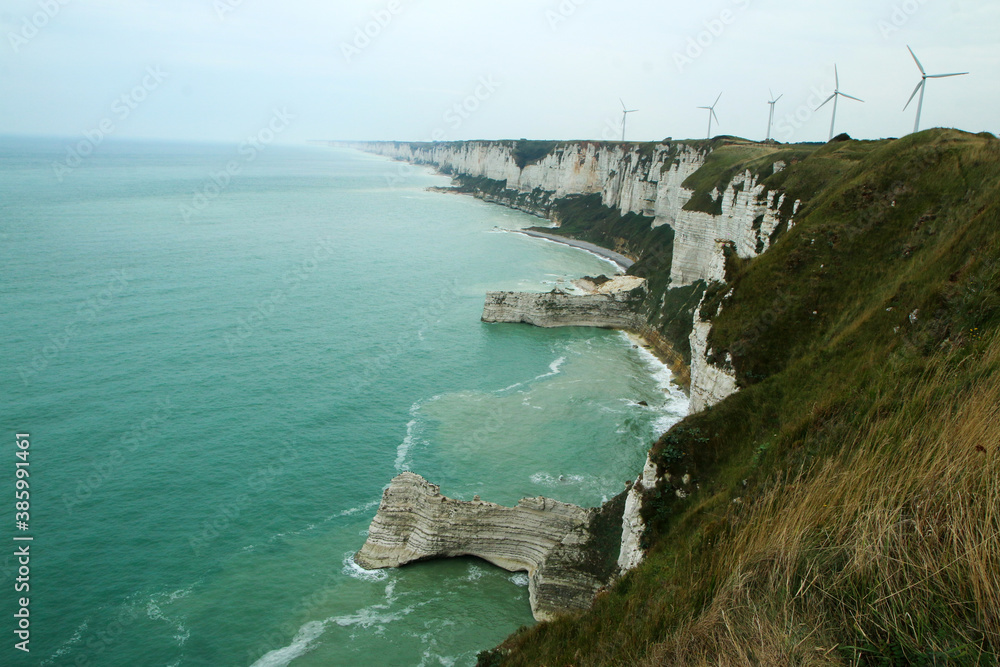 Fototapeta premium The cliffs of Normandy by the French city of Fécamp during the calm bright day. 