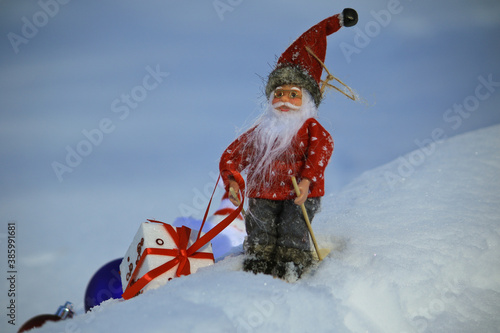santa Claus skiing with the gift