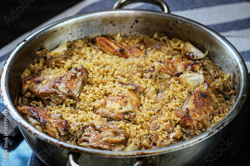 Stewed chicken with onion confit and bulgur.