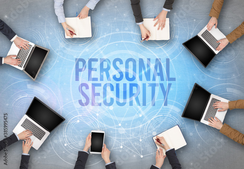 Group of people in front of a laptop with PERSONAL SECURITY insciption, web security concept