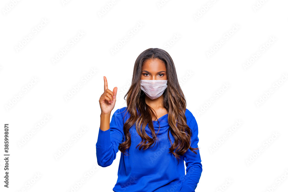 Masked woman - protection against influenza virus. African - American woman wearing medical mask for protect. model poses in studio making hand gesture. Stop the virus and epidemic diseases. isolated Masked woman - protection against influenza virus. African - American woman wearing medical mask for protect. model poses in studio making hand gesture. Stop the virus and epidemic diseases. isolated