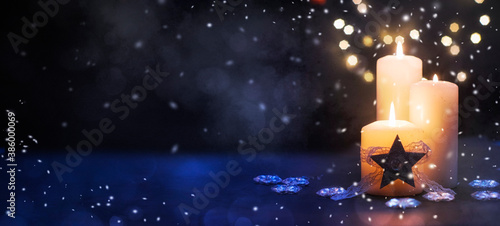 Christmas Candles, Christmas and New Year holidays background, winter season. © Guschenkova