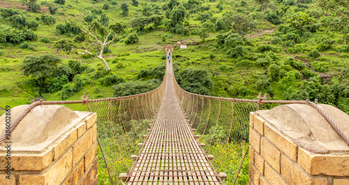 A bridge over a rapid stream to the Blue Nile Falls viewpoint. 