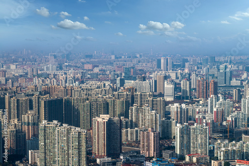Wallpaper Mural aerial view of Shanghai cityscape and modern skyscraper city in misty sky background behind pollution haze, in Shanghai, China. Torontodigital.ca