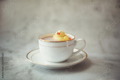 marshmallow like a duck in the cup with hot cocoa and near cup