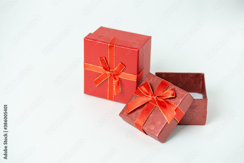 Red open gift boxes with ribbon and bow on white background. For new year, Christmas, Valentine's day and other holiday compositions copy space for text Red open gift boxes with ribbon and bow on white background. For new year, Christmas, Valentine's day and other holiday compositions copy space for text