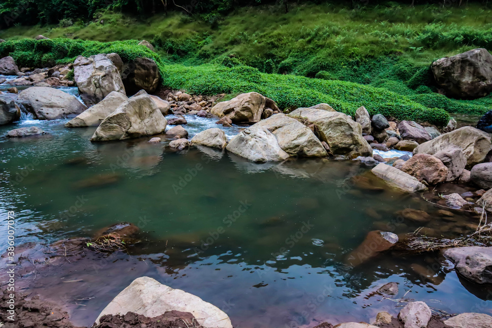 River flows over rocks in this beautiful scene River flows over rocks in this beautiful scene