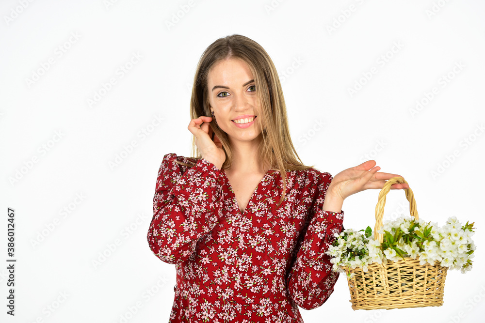 Spring everywhere. female florist designer. womens and mothers day. girl at flower shop. natural gift. happy woman carry flowers in basket. spring blossom arrangement. beautiful summer bloom