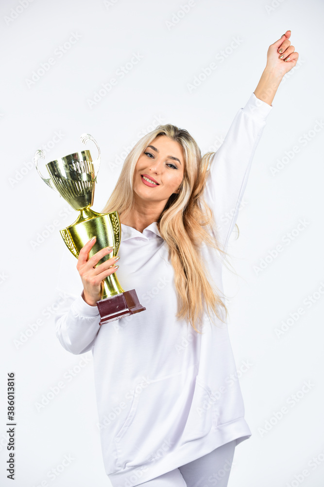 happiness. win the award. this is the victory. congratulations concept. female competition winner. happy sportswoman. showing her trophy. sport success. successful fitness woman hold champion cup happiness. win the award. this is the victory. congratulations concept. female competition winner. happy sportswoman. showing her trophy. sport success. successful fitness woman hold champion cup