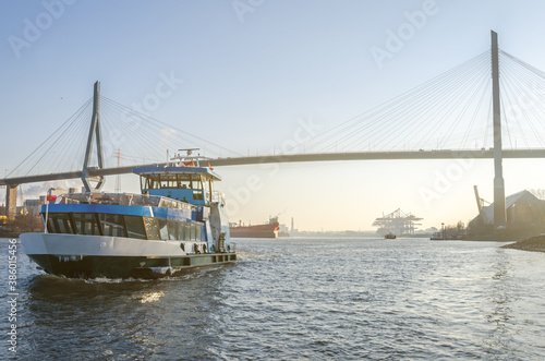 Harbor ferry and famous bridge (Köhlbrandbrücke) during scenic afternoon light in Hamburg, Germany © Calado