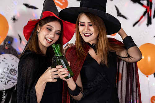 Asian women celebrate cheers in Halloween party