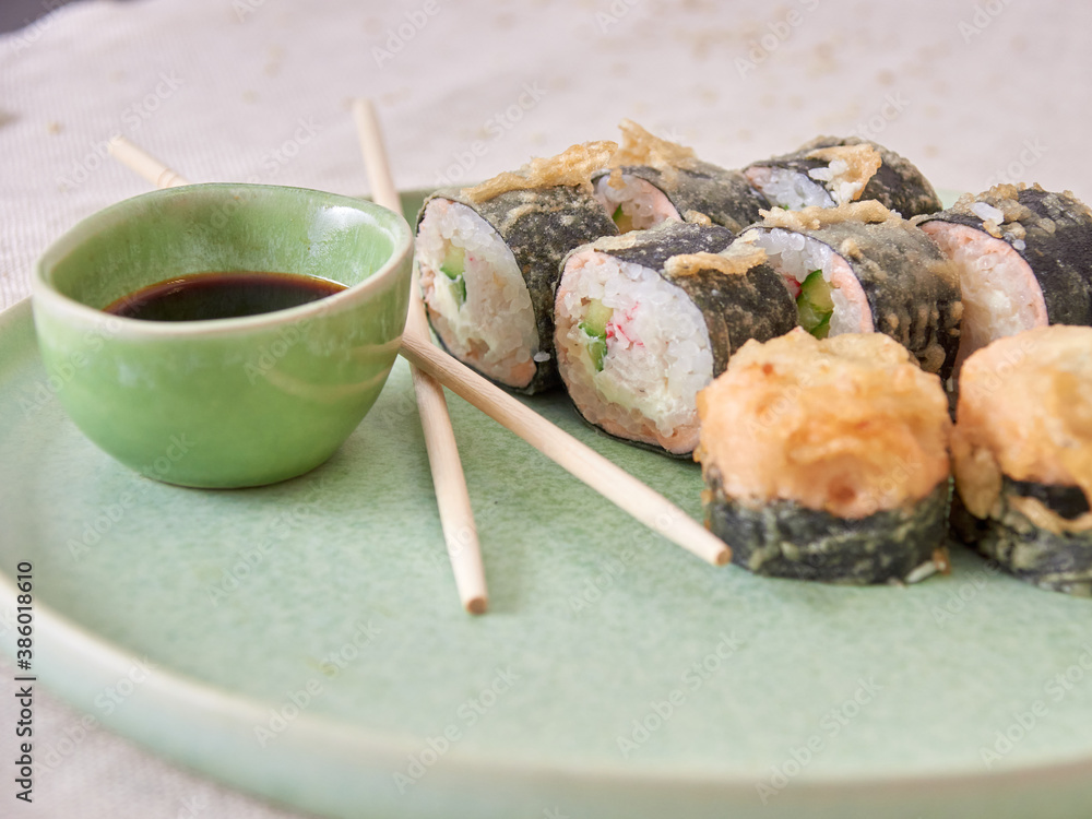 Fotografie Fresh sushi rolls on a plate