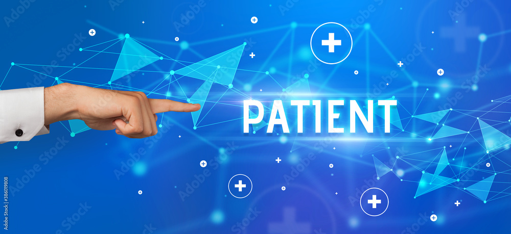Close-Up of cropped hand pointing at PATIENT inscription, medical concept Close-Up of cropped hand pointing at PATIENT inscription, medical concept