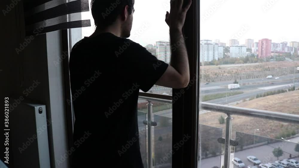 Person looking through window Person looking through window