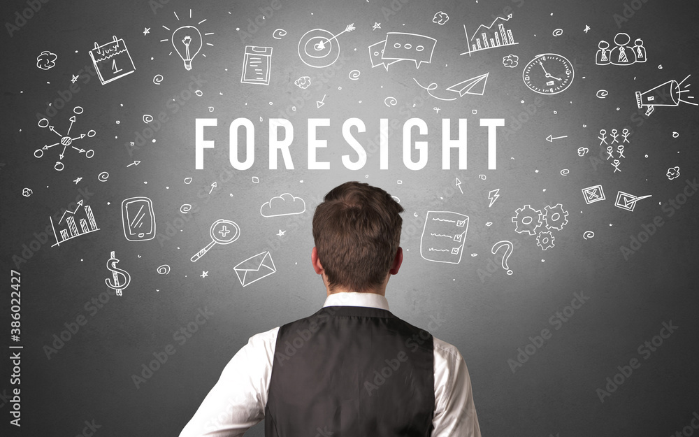 Rear view of a businessman with FORESIGHT inscription, modern business concept Rear view of a businessman with FORESIGHT inscription, modern business concept