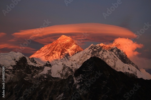 Scenic red sunset on Mount Everest Sagarmatha and Lhotse as seen from Gokyo Ri with cloud above Everest, Gokyo, Sagarmatha Khumbu Region, Nepal Himalaya