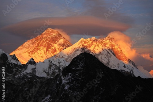 Scenic red sunset on Mount Everest Sagarmatha and Lhotse as seen from Gokyo Ri with cloud above Everest, Gokyo, Sagarmatha Khumbu Region, Nepal Himalaya