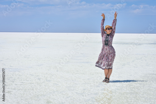 woman in dress on a white salt lake, portrait of a woman on a white salt lake © Олег Спиридонов