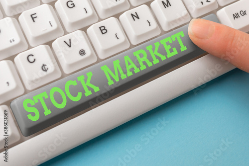Word writing text Stock Market. Business photo showcasing Particular market where stocks and bonds are traded or exhange Different Colored PC keyboard key With Accessories on Empty background photo