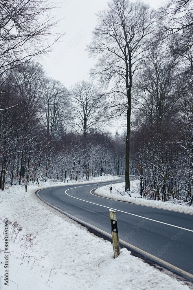empty winter road in the snow