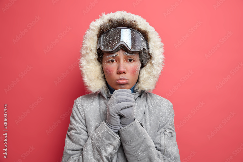 Ταπετσαρία Headshot of miserable displeased woman with cold face keeps hands together looks with imploring expression at camera wears warm winter jacket spends vacation actively