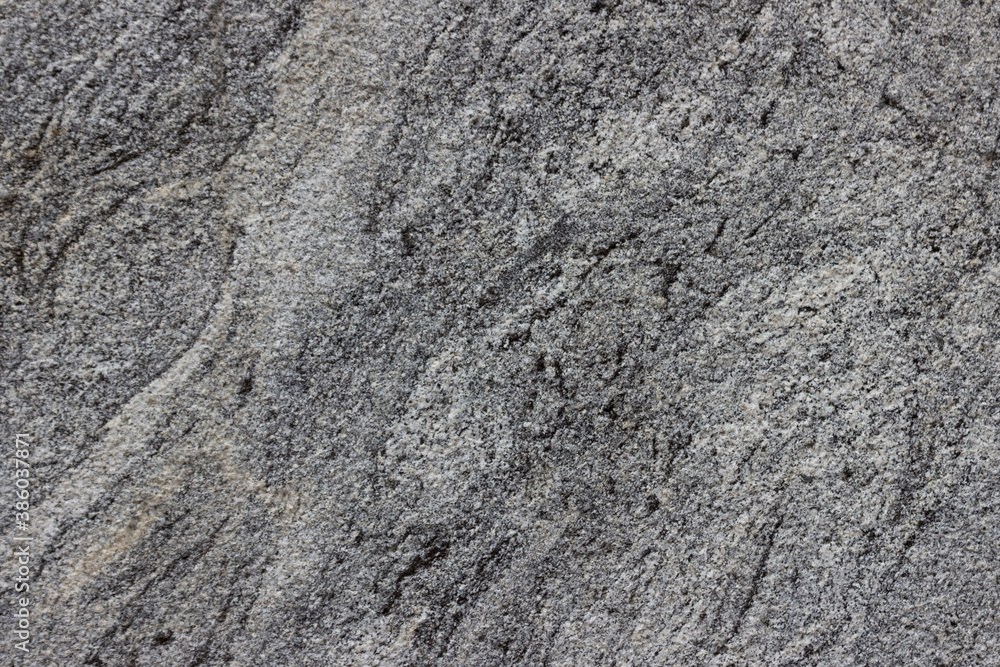 The texture of a natural stone slab from polished granite. The texture of a natural stone slab from polished granite.