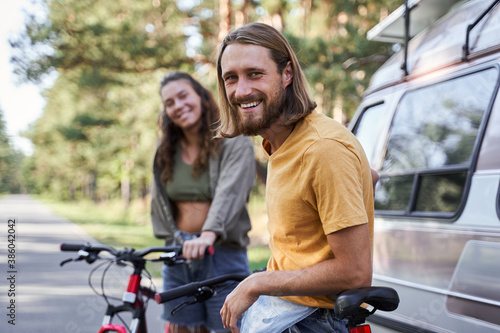 Couple standing with bikes