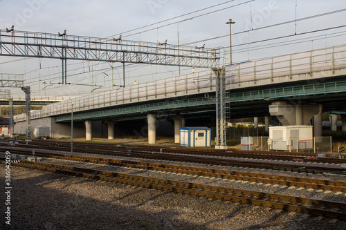 Urban landscape - railway station with rails and platform and road bridge in Moscow Russia