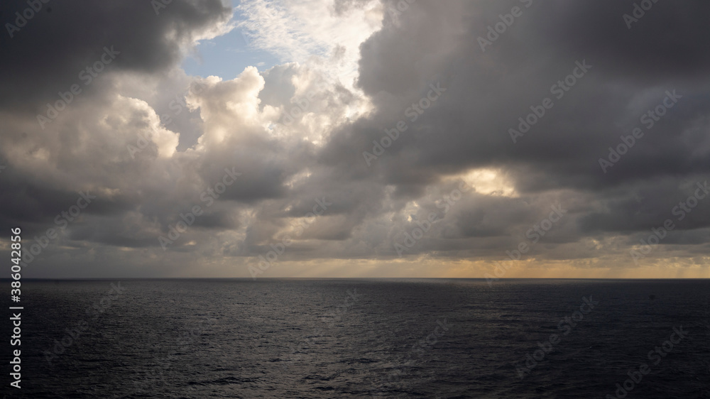 Dramatic cloudscapes over the open ocean at sea from Cruise ship