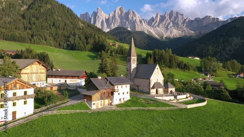 Aerial of the beautiful Santa Maddalena Church, Val Di Funes, Dolomites, Northern Italy