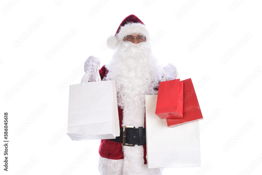 Senior man wearing a traditional Santa Claus costume holding several gift bags in both hands. Isolated on white. Senior man wearing a traditional Santa Claus costume holding several gift bags in both hands. Isolated on white.