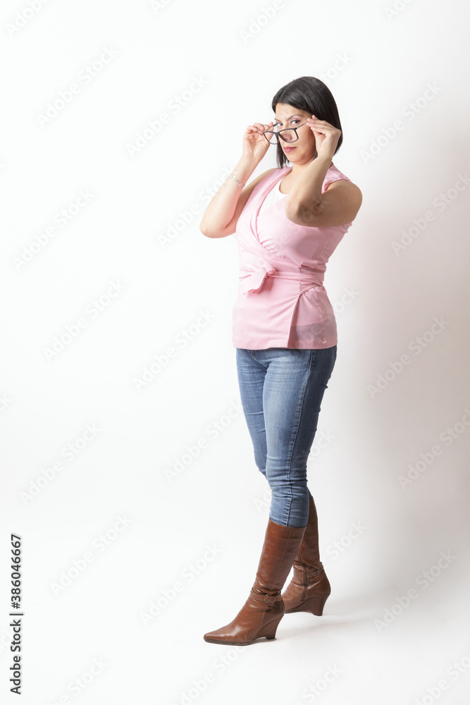 woman in studio posing with casual attire and glasses woman in studio posing with casual attire and glasses