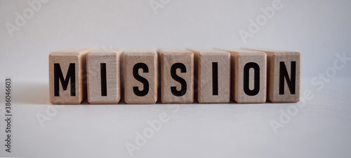 word MISSION, inscription on wooden cubes on white background