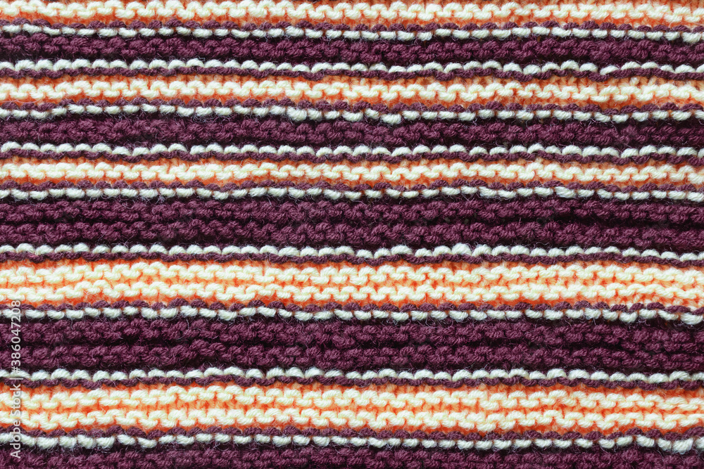 Striped background, homemade wool knitted texture Striped background, homemade wool knitted texture