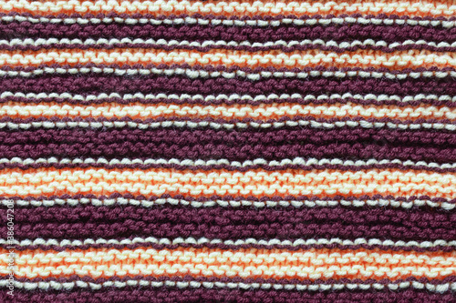 Striped background, homemade wool knitted texture