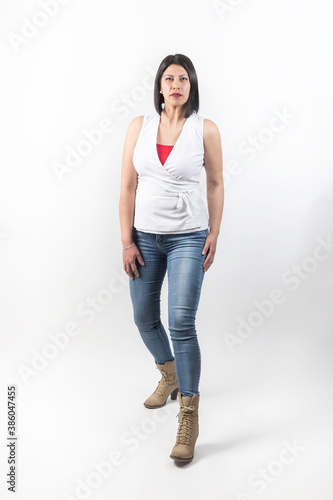 latin woman with casual attire posing in studio