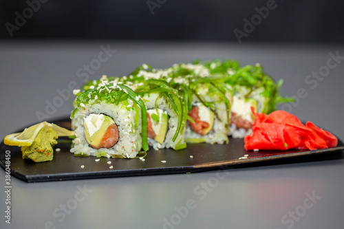 japanese sushi food. Vegetarian sushi rolls avocado with cream Philadelphia cheese, sesame, unagi sauce. Sushi menu. Japanese food. Top view of assorted sushi.