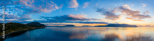 Sunset Over Orcas Island in the Salish Sea and the San Juan Island Archipelago. Beautiful and dramatic sunset with colorful clouds and a calm sea in the Pacific Northwest.