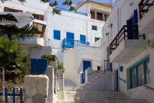 Traditional alley road in Chora district of naxos island, with houses © greta gabaglio