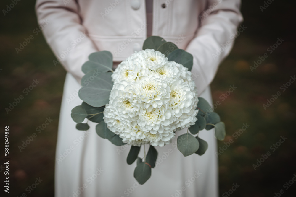 bride holding flowers at her wedding bride holding flowers at her wedding