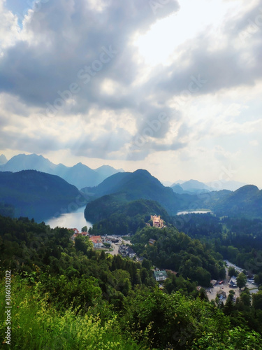 Misty day in the Bavarian Alps near Fussen  Germany. Alps and lakes in a summer day in Germany. Taken from the hill next to Neuschwanstein castle. View of the Hohenschwangau castle  Bavarian Alps