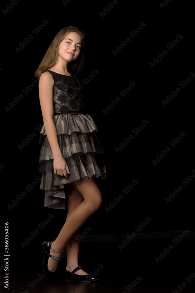 Beautiful young teen girl studio photo on black background Beautiful young teen girl studio photo on black background