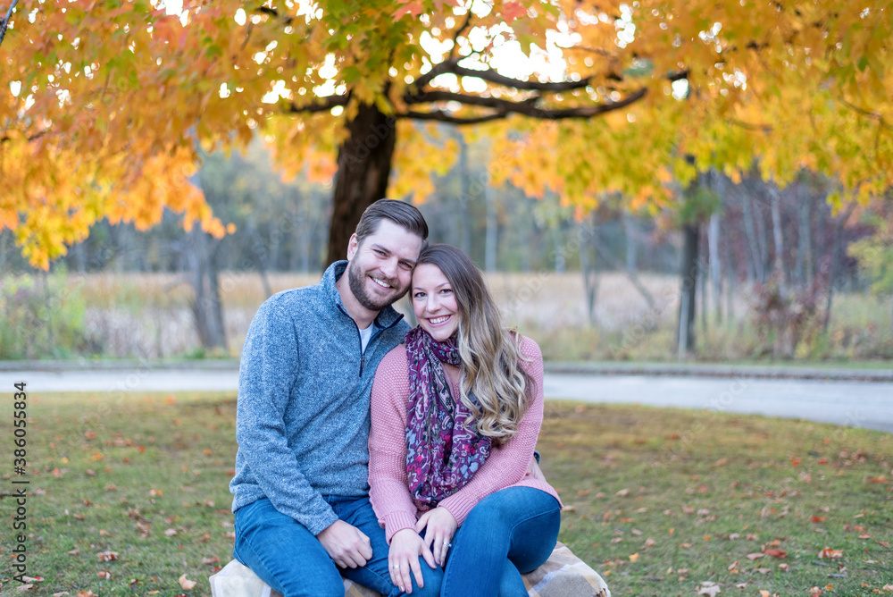 Cute young couple at the park on an autumn day Cute young couple at the park on an autumn day