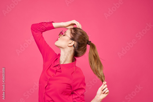 Woman in pink shirt and brown glasses cropped view fashion model emotions gesturing hands portrait