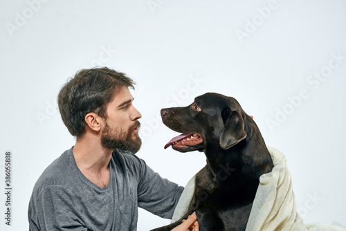 Happy man with dog and light fabric fun scarf friends pet