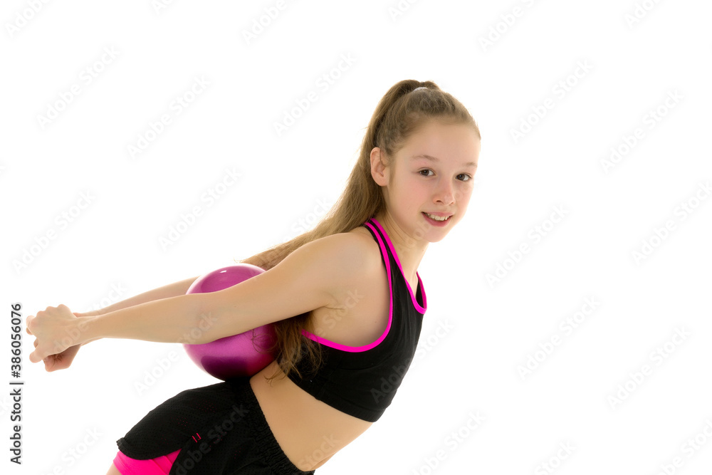 Girl gymnast performs exercises with the ball. Girl gymnast performs exercises with the ball.