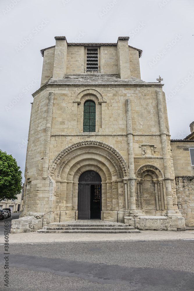 XII century Romanesque style Eglise Collegiale on St Emilion’s Place Pierre Meyrat. SAINT-EMILION, BORDEAUX, FRANCE. April 14, 2019.