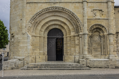 XII century Romanesque style Eglise Collegiale on St Emilion’s Place Pierre Meyrat. SAINT-EMILION, BORDEAUX, FRANCE. April 14, 2019. © dbrnjhrj